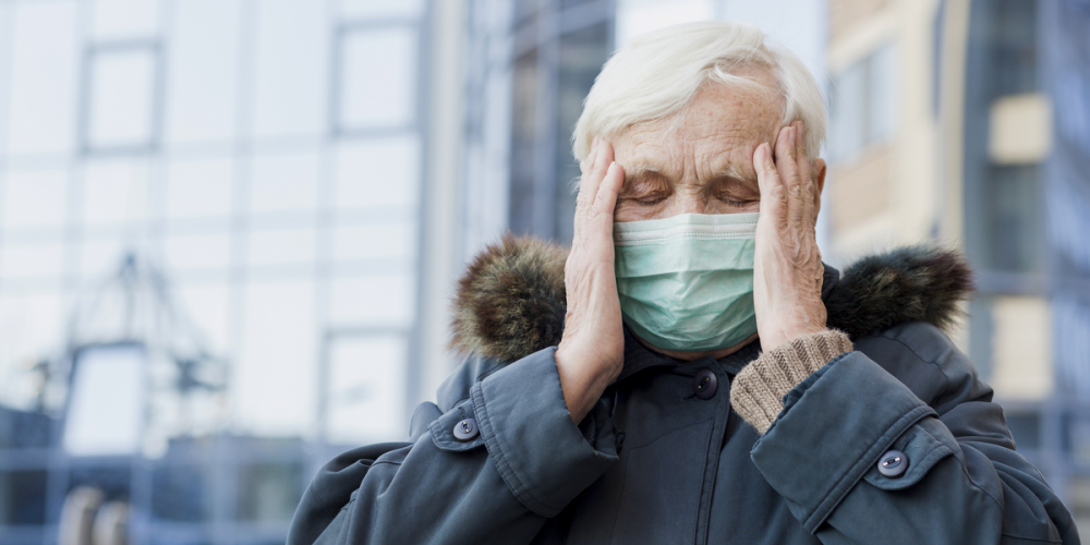 front-view-elder-woman-with-medical-mask-feeling-well-while-being-outside